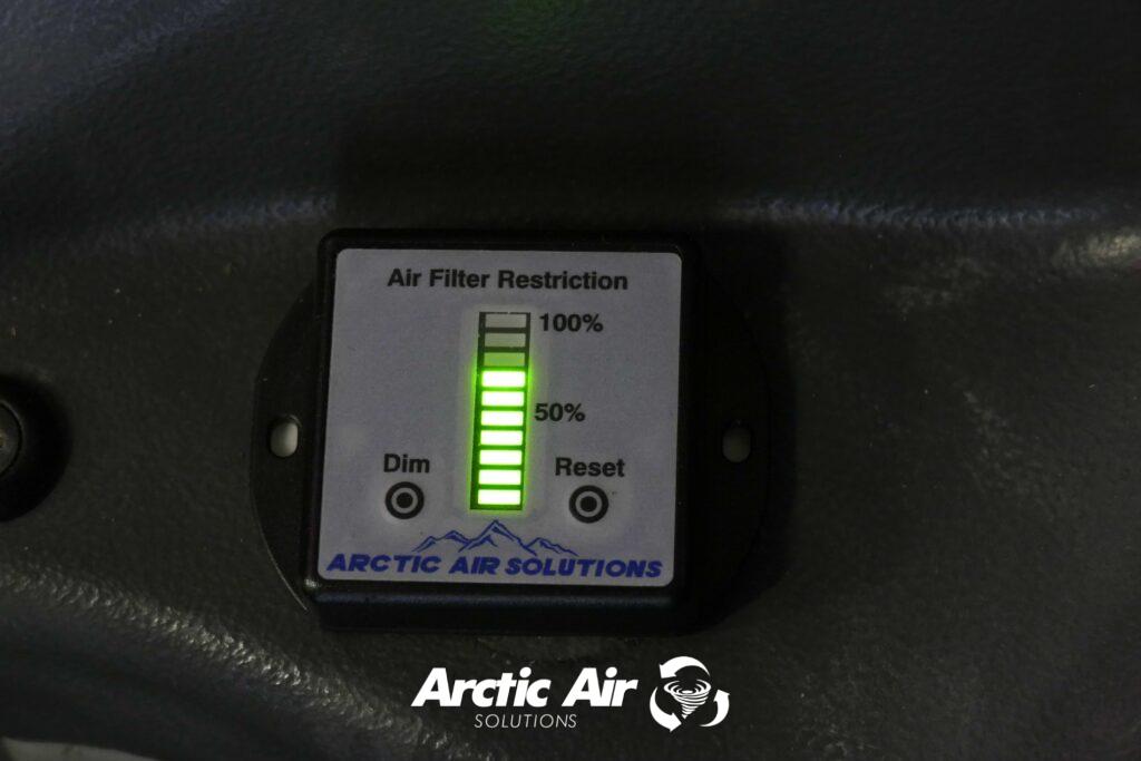 Air filter restriction gauge showing seven illuminated bars.